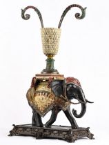 A hand painted cast brass/bronze elephant with vase top