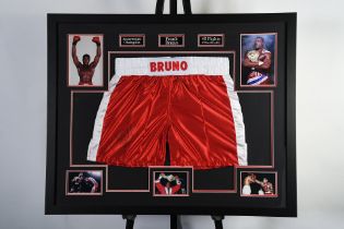 A very nicely framed pair of boxing shorts which FRANK BRUNO has personally signed