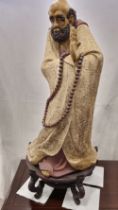 An original hand made Shiwan porcelain sculpture of an Oriental monk