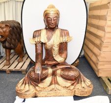 A unique wooden hand made very large sitting Buddha with gold colour decoration standing