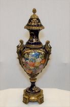 A hand made Chinese porcelain trophy vase with high grade painting and gold detailed finish