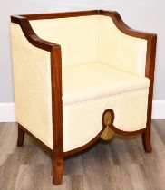 The frame is made from solid rosewood and upholstered around the chair in a cream material