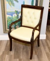 A hand-made chair with the frame made from solid rosewood that has been highly polished and