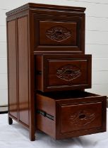 A solid rosewood filing cabinet which houses three lockable drawers and displays a bird and flower