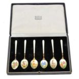 A cased set of Elizabeth II silver and enamel spoons,