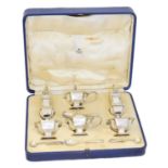 An Edward VIII cased silver cruet set,