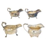 Four silver sauce boats,