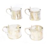 Four silver mustard pots,