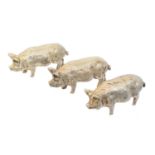 Three Elizabeth II silver models of pigs,