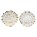 A pair of silver shell shaped dishes,