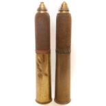 Two inert British 18 pounder shells, the with fired head and fuse, the cartridge case dated 1918 and