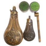 Two powder flasks, a measure and two Joyce cap tins