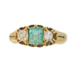A late Victorian 18ct gold emerald and diamond three stone ring,