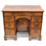 George II Walnut and Feather-Banded Kneehole Desk