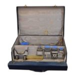 A George V silver and enamelled dressing table set,