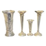 Four silver vases,