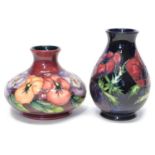 Two Moorcroft vases in Pansy and Anenome