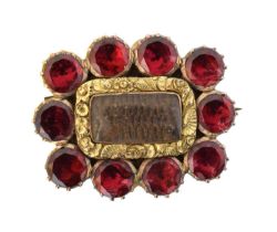 An early 19th century garnet mourning brooch,