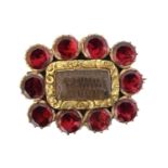 An early 19th century garnet mourning brooch,