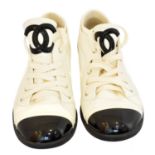 A pair of Chanel leather trainers,
