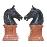 Two Bronze Horse Heads on Marble Plinths