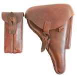 Luger holster, stripping tool, magazine and two division magazine pouch.