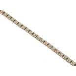 An 18ct gold diamond line bracelet,