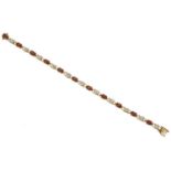 A 9ct gold garnet and diamond bracelet,