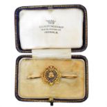 A sweetheart/regimental brooch,