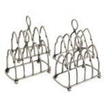 Four silver miniature toast racks,