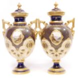 Pair of Coalport twin handled lidded vases