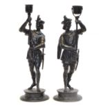 Two 19th century spelter figures of soldiers holding braziers