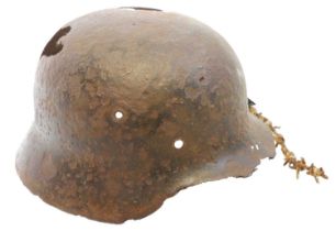 German relic helmet and a section of barbed wire