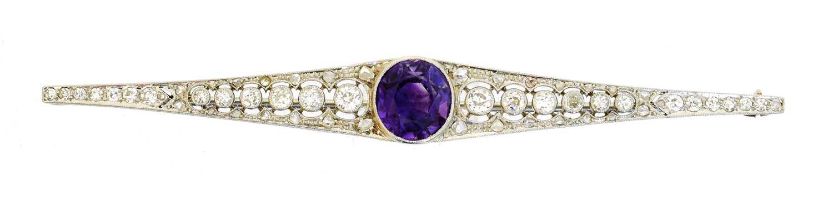 An amethyst and diamond brooch,