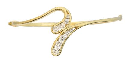An 18ct gold diamond bangle by David M Robinson,