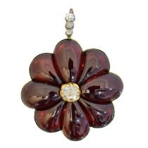 A late Victorian garnet and rose cut diamond brooch,