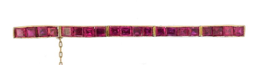 A synthetic ruby bar brooch,