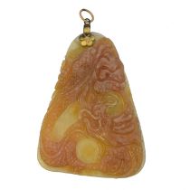 A carved jade pendant,