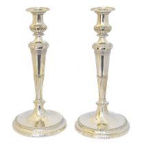 A pair of George III silver candlesticks,
