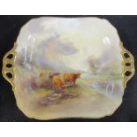A Royal Worcester square dish, with twin handles, decorated with Highland cattle in a landscape by J