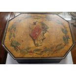 A 19th century Regency octagonal ebonised work box, the lid painted with a central panel of sheet