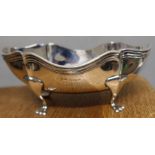 An oval silver bowl, with shaped edge, raised on four scroll legs, Birmingham 1912, weight 5oz