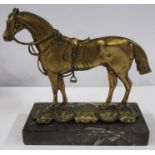 A 19th century gilt-brass flat back model, of a horse in full harness on a marble base