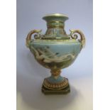 A Royal Worcester vase, decorated with swans in flight by C H C Baldwyn, to a powder blue ground,