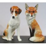 Two Royal Worcester models, of a seated Hound and a Fox, height 7ins
