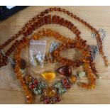 A white metal amber set necklace, together with other amber bead necklaces etc