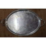 A Georgian oval silver tray, with gadrooned handles, having a presentation inscription to the center