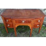 A mahogany break bow front sideboard, fitted with a drawer flanked by two drawers to each side,