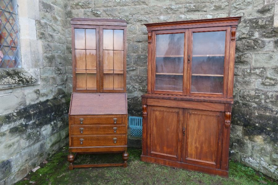 A 19th century mahogany bookcase cupboard, the upper section with two glazed drawers over a drawer