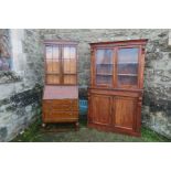 A 19th century mahogany bookcase cupboard, the upper section with two glazed drawers over a drawer